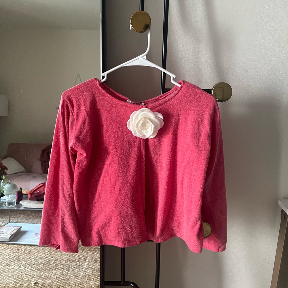 Out from under little pink cardigan with rose detail 🩷🌹